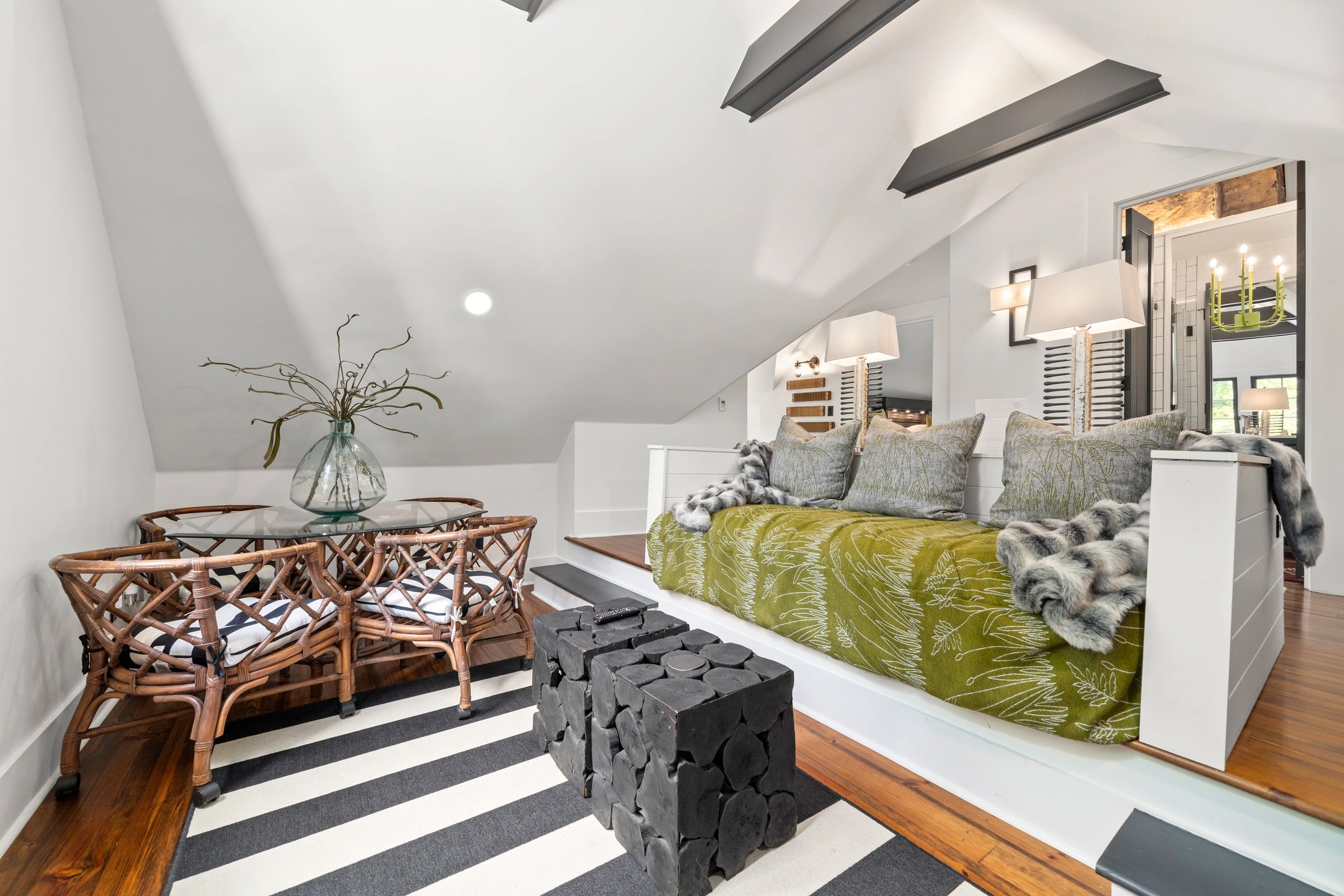 Modern attic living room with cozy seating and natural light